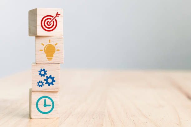 istock Concept of business strategy and action plan. Wood cube block stacking with icon 1257159277
