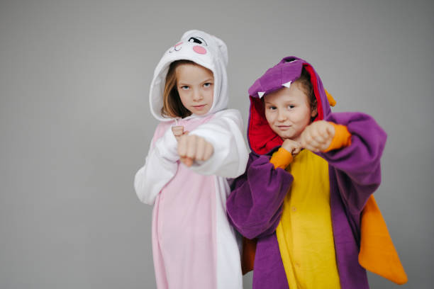 istock two girls dressed as rabbit and dragon posing 1257160008
