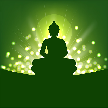 Buddha silhouette and abstract light on green background for Buddhism