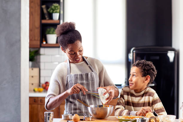 istock Mother with his son prepare pie in the kitchen 1257163398