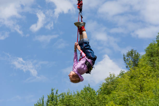 istock Senior lady bungee jump 1257168703