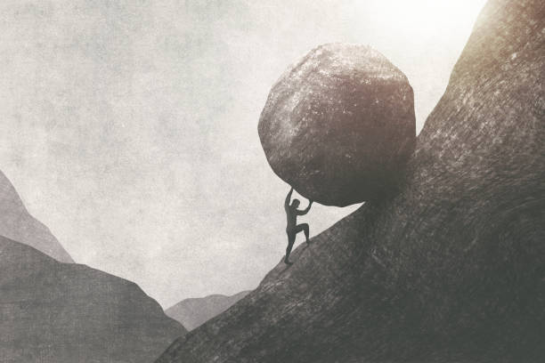 strong man pushing big rock uphill, surreal concept stock photo
