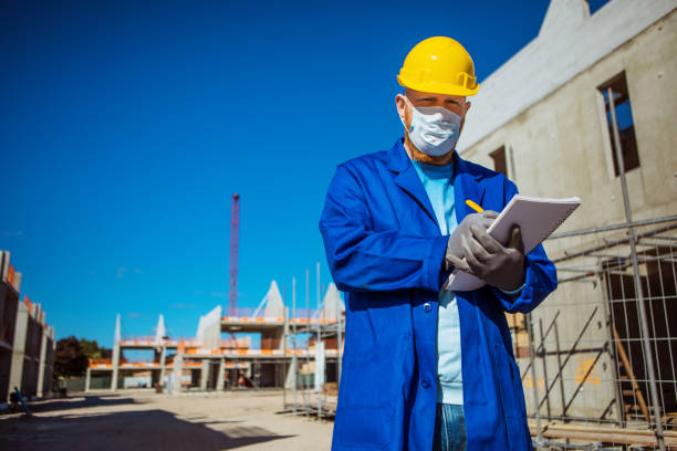 istock A handsome redhead building site foreman wearing a corona mask 1257170069