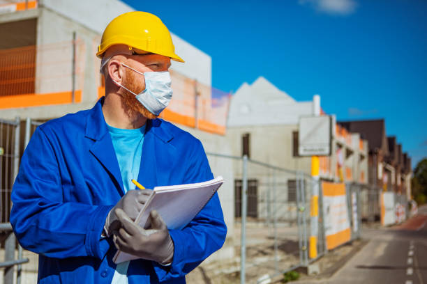 istock A handsome redhead building site foreman wearing a corona mask 1257170236