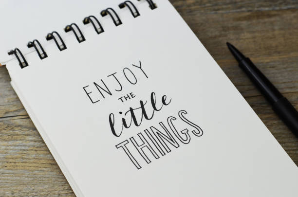 istock ENJOY THE LITTLE THINGS handwritten in notebook 1257170419