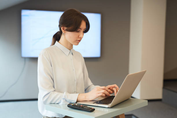 istock Young Businesswoman Working at Standing Table 1257170532