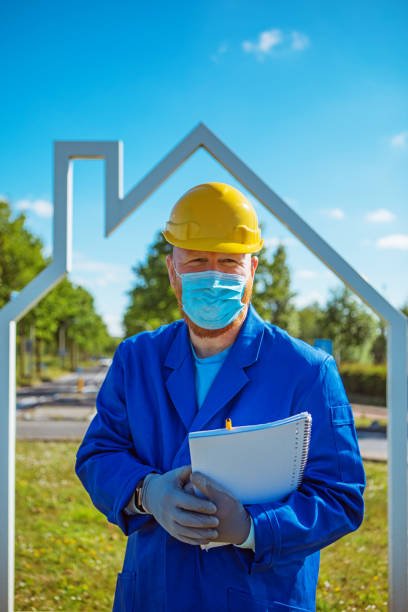 istock A handsome redhead building site foreman wearing a corona mask 1257170601