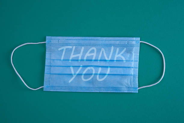istock face mask with single word thank you 1257170766