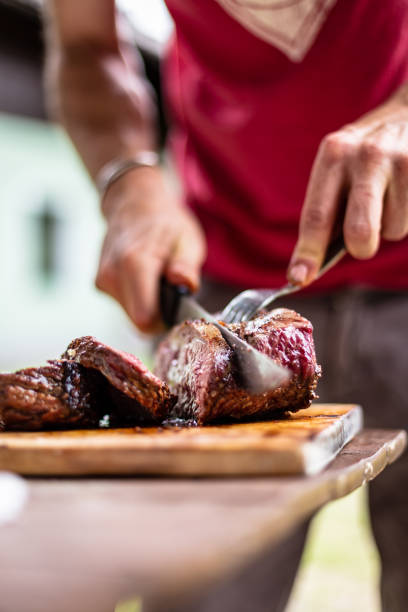 istock barbeque meat preparation in a summer day 1257173843