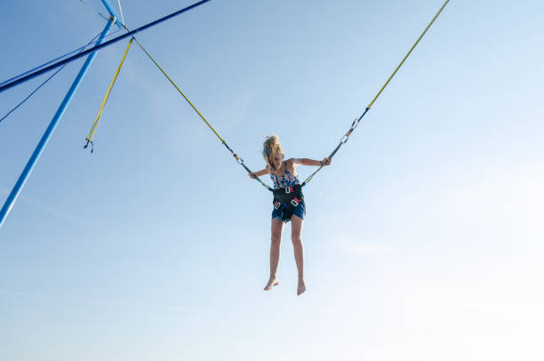 istock child jumping in the jumping attraction 1257174884
