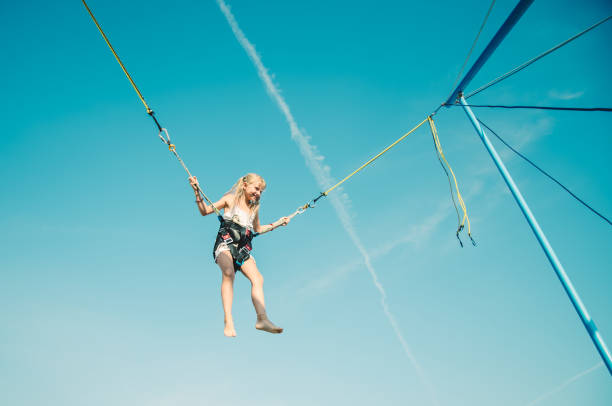 istock child jumping in the jumping attraction 1257174886