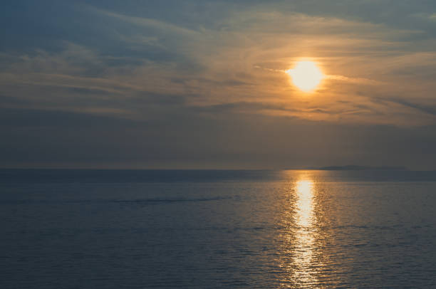 istock orange sunset at the sea 1257175104