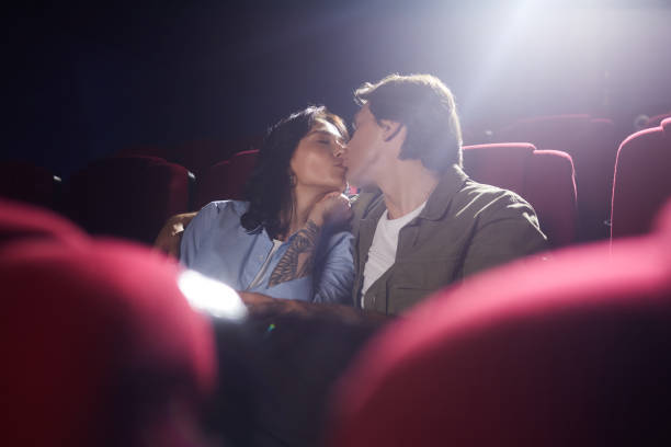 istock Couple Kissing on Date in Cinema 1257175437