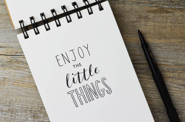 istock ENJOY THE LITTLE THINGS handwritten in notebook 1257175509