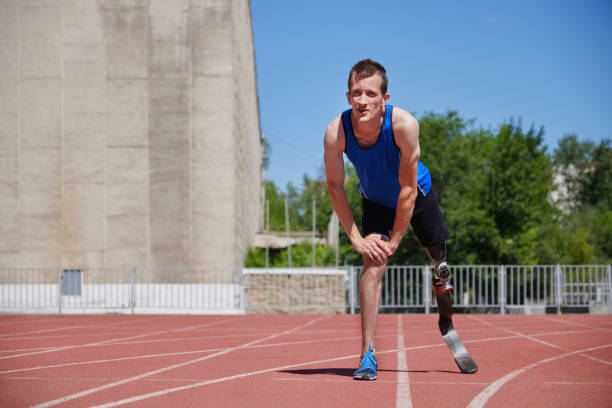 istock Adaptive sportsman preparing for jogging at the stadium 1257180666