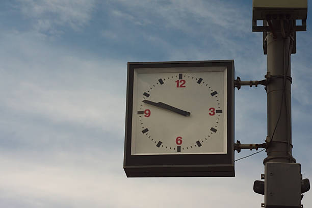 istock square clock on the background of cloudy summer sky 1257181707