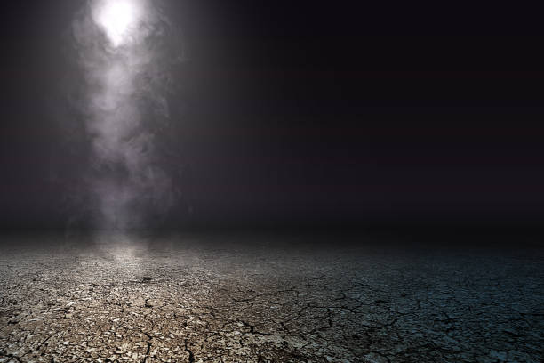 istock Cracked ground with smoke and fog 1257182521