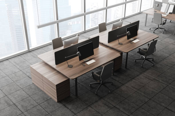 istock Panoramic office with wooden tables, top view 1257185565