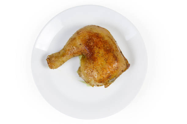 istock Top view of fried chicken leg quarter on white dish 1257186992
