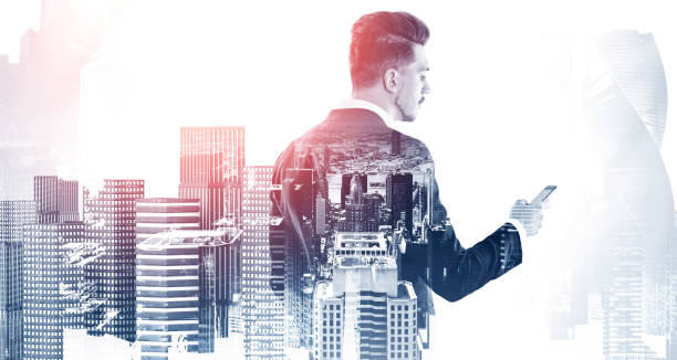 istock Businessman with smartphone in city 1257187242