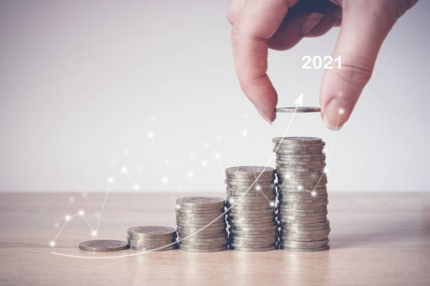 istock 2021. Coins Stack with virtual hologram stat, graph. Concept of money saving, financial. 1257187295