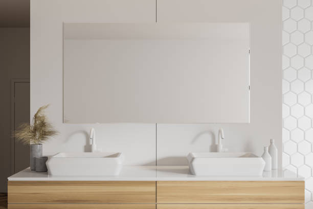 istock Double sink in white honeycomb tile bathroom 1257188369