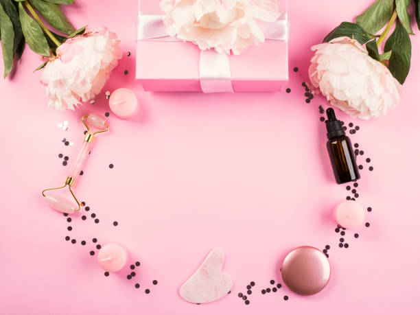 istock Pink beauty tools background with flowers 1257189130