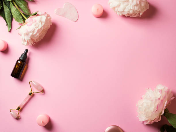 istock Pink beauty lifting tools background with flowers 1257189131