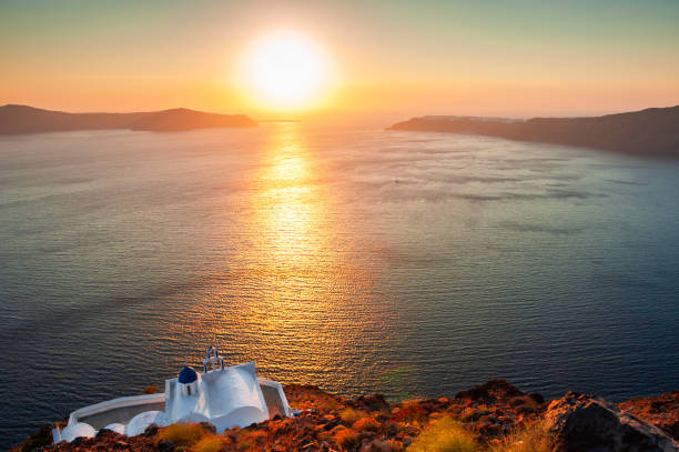 istock Small church on the cliffs, Santorini island, Greece. 1257190147