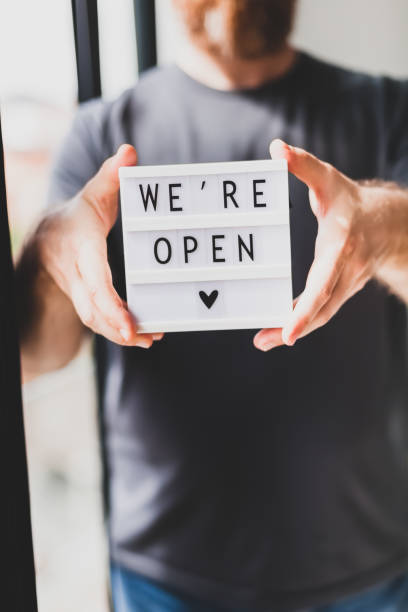 istock End of quarantine. Greeting message We're open 1257190699