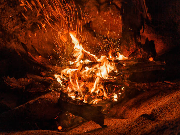istock Bonfire with sparkles by the rock. 1257190773