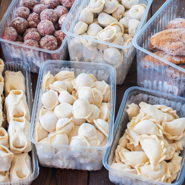 Assortment of Pocket items. Semifinished meatballs, dumplings, pierogi. Assortment of Pocket items. Semifinished meatballs, dumplings, pierogi in plastic containers. russian pelmeni stock pictures, royalty-free photos & images
