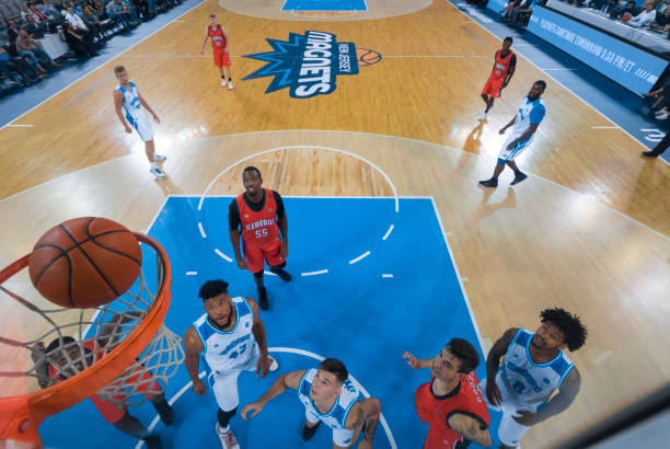 istock Basketball players looking at ball 1257195373