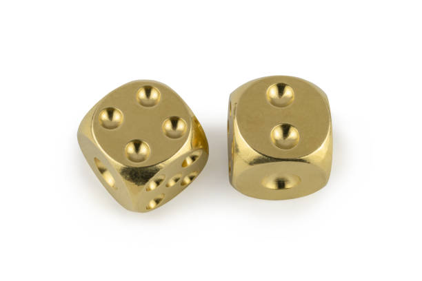 istock Two golden dices closeup isolated on white background. Four and two, with a shadow. 1257196910