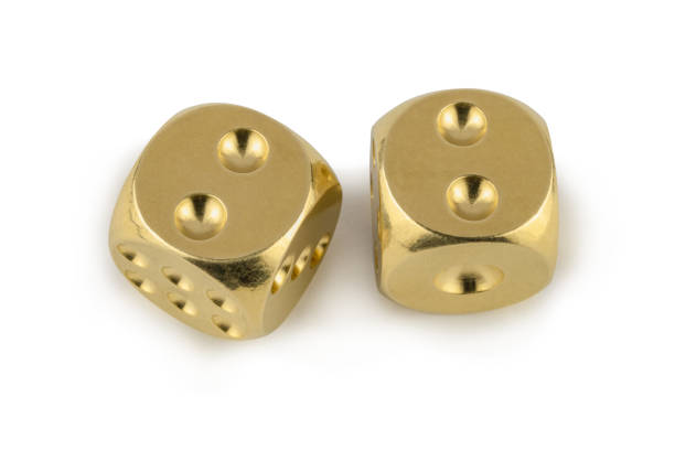 istock Two golden dices closeup isolated on white background. Two and two, with a shadow. 1257196963