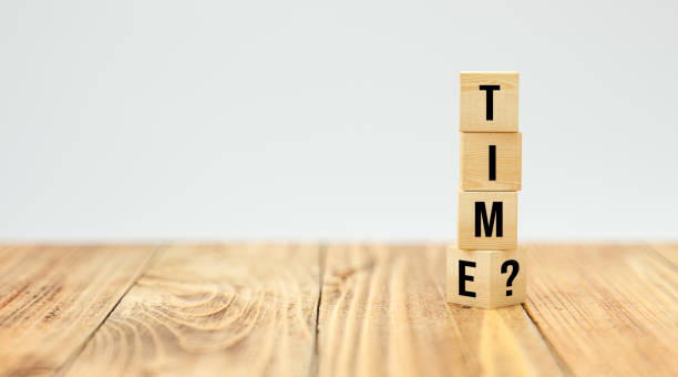istock cubes with message TIME? on wooden floor - 3d illustration 1257198993