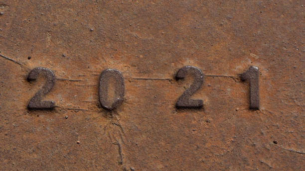 istock 2021 number on ancient rusty metal surface. Happy new year 2021 concept photo. 1257199499