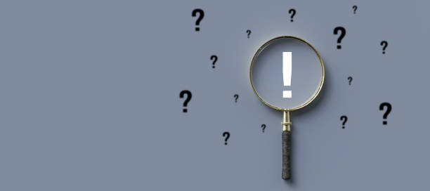 istock magnifying glass with exclamation mark as symbol for finding a solution - 3d illustration 1257199523