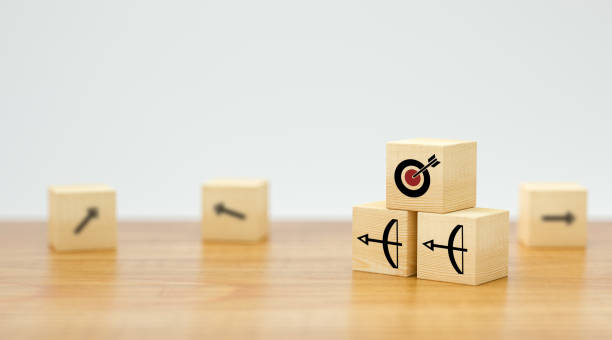 istock stacked cubes with arrow symbols pointing towards a target - 3d illustration 1257200766