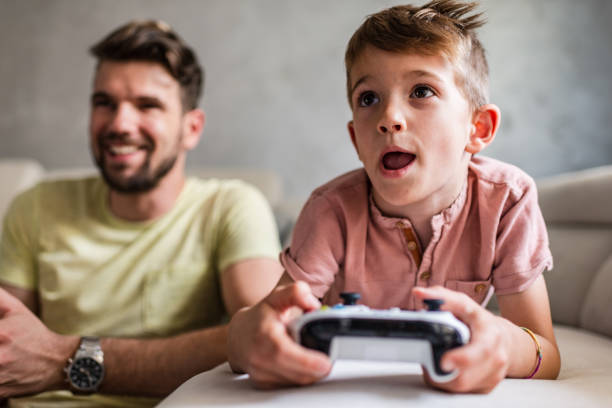 istock Playing video games with my dad 1257201443