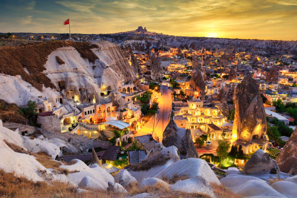 Illuminated Goreme Vilage Ancient Goreme town and castle of Uchisar at night tufa photos stock pictures, royalty-free photos & images