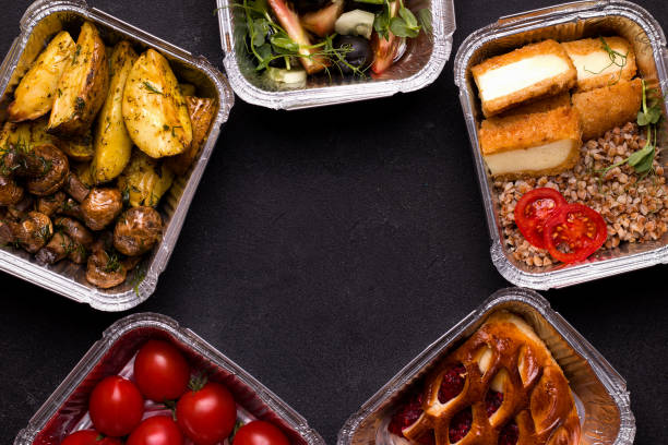 istock Food in containers on a black background. Copy space 1257205639