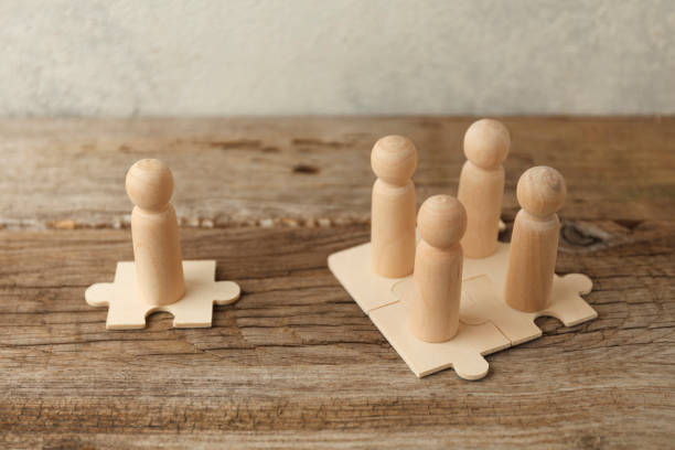 istock Wooden figures on puzzles. People analytics and optimization, team building. Group connection in business 1257205670