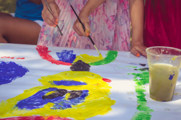 istock hand of child coloring white paper 1257210915