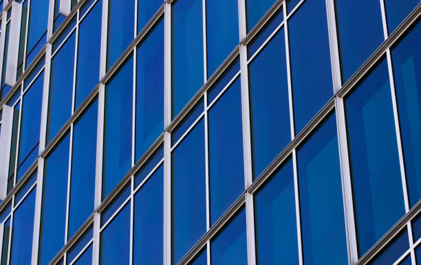 istock Repeating pattern of blue Windows in close-up.Facade of a modern office building. 1257212069