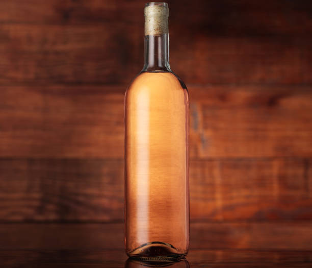 istock bottle of pink wine with a cork 1257213095