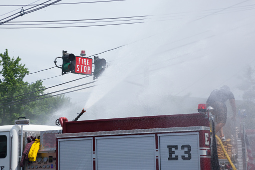 COLONIA, NEW JERSEY / UNITED STATES - June 6, 2015: Fire trucks from various towns participating in the 2015 Colonia Fire Department wet down.
