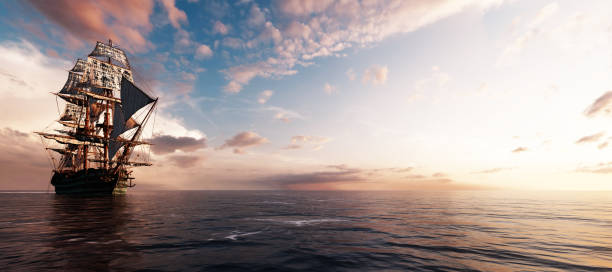 istock Pirate ship sailing on the ocean at sunset 1257217801