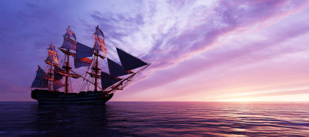 istock Pirate ship sailing on the ocean at sunset 1257217847