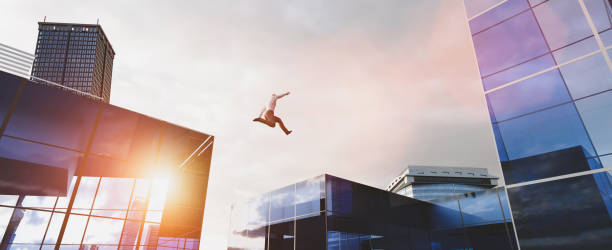 istock Man jumping between skyscrapers. Business success 1257217881